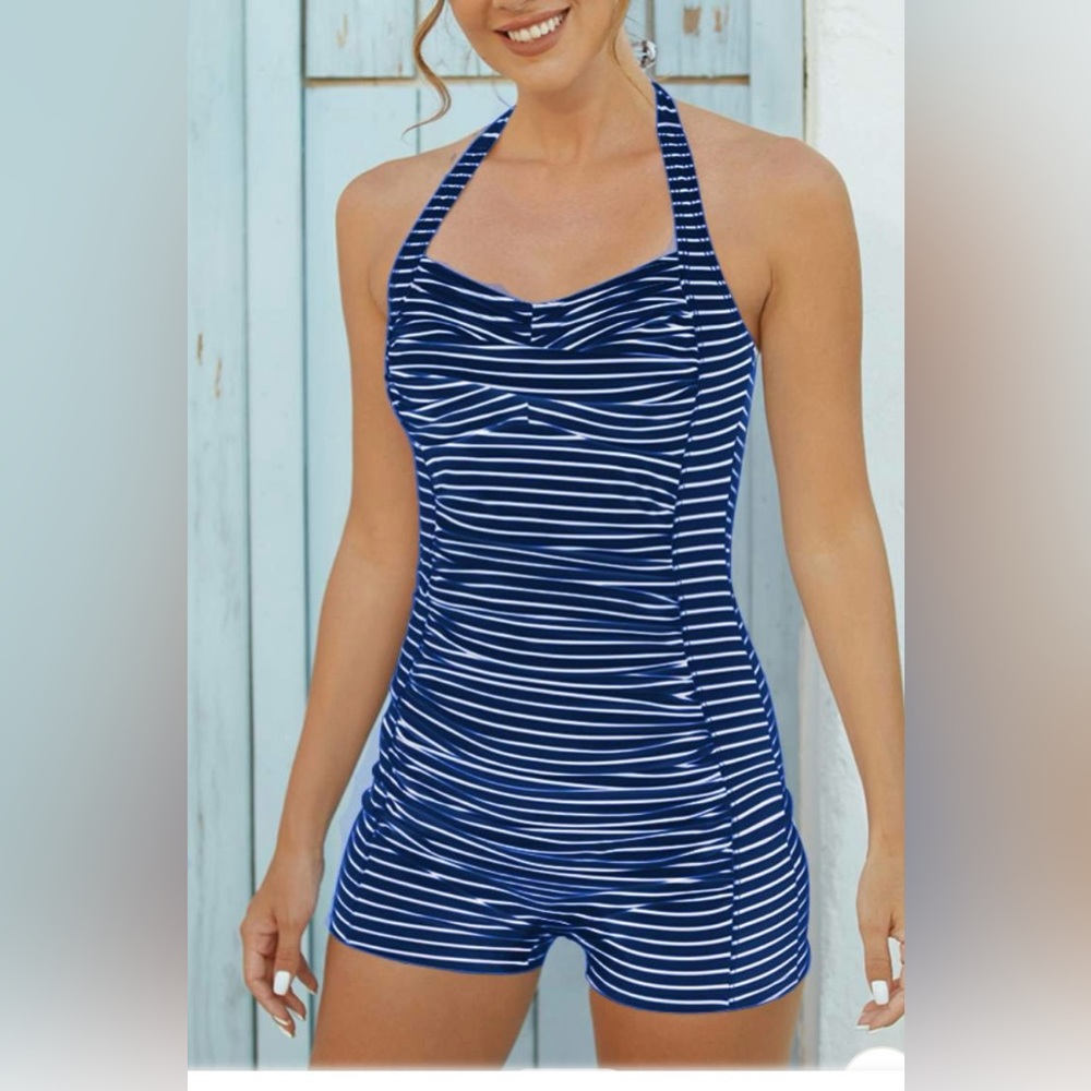 One piece bathing suite with shorts as bottoms , halter top with padding